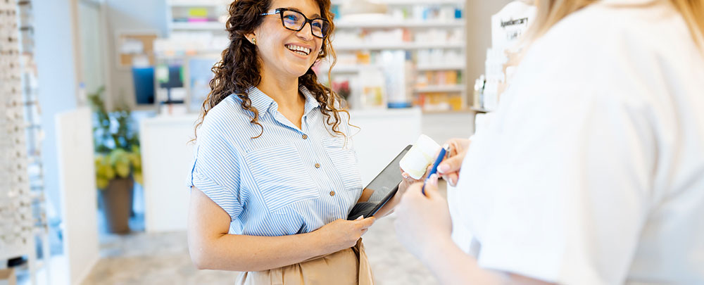 Woman smiling while talking to another person